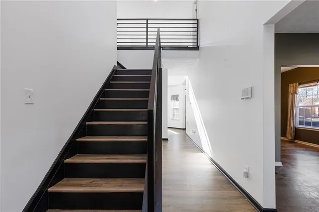 en view of entryway and hall with wooden floor