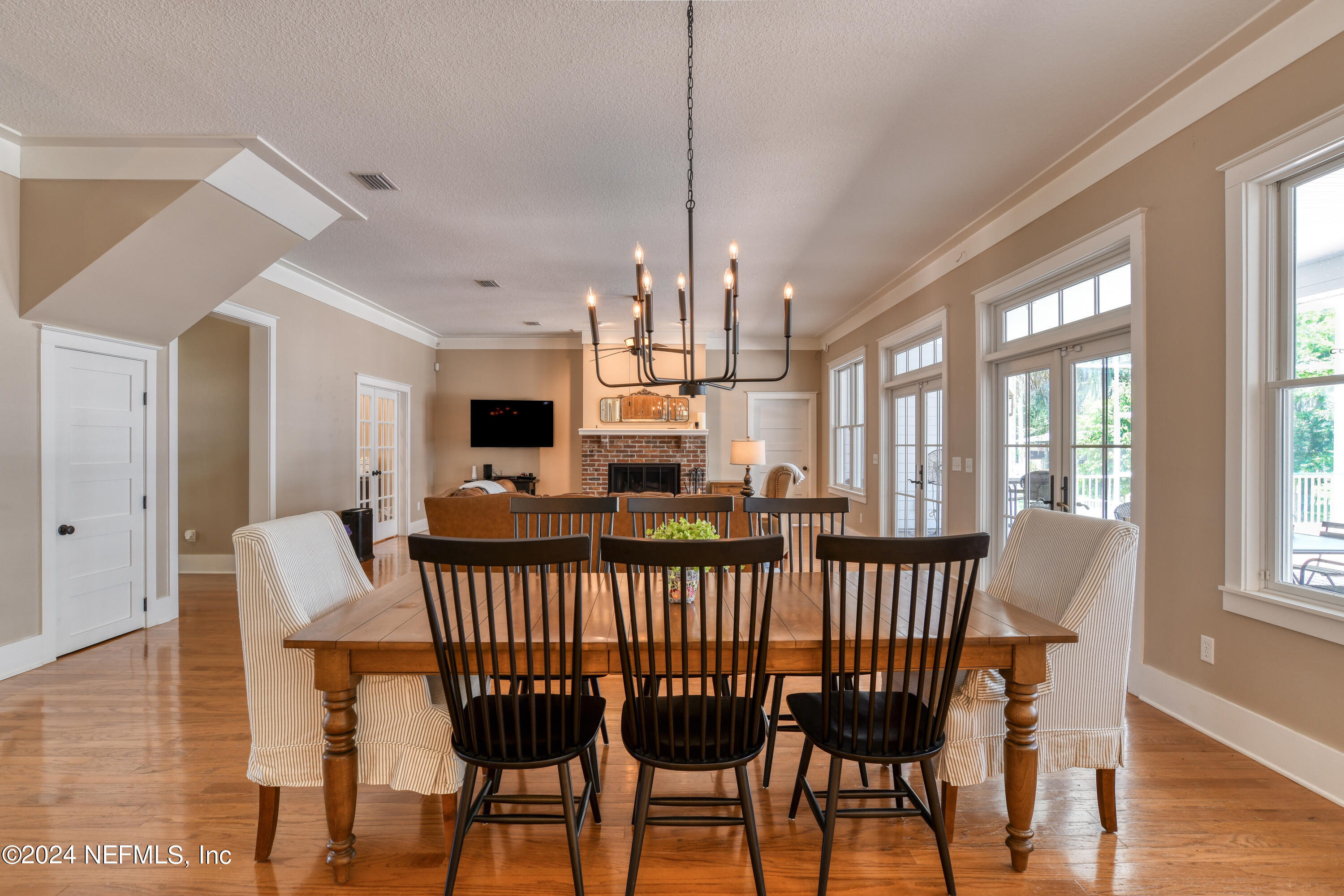 560 Clifton Road Crescent City, FL 32112 - Photo 17 of 73 a view of a dining room with furniture window and wooden floor
