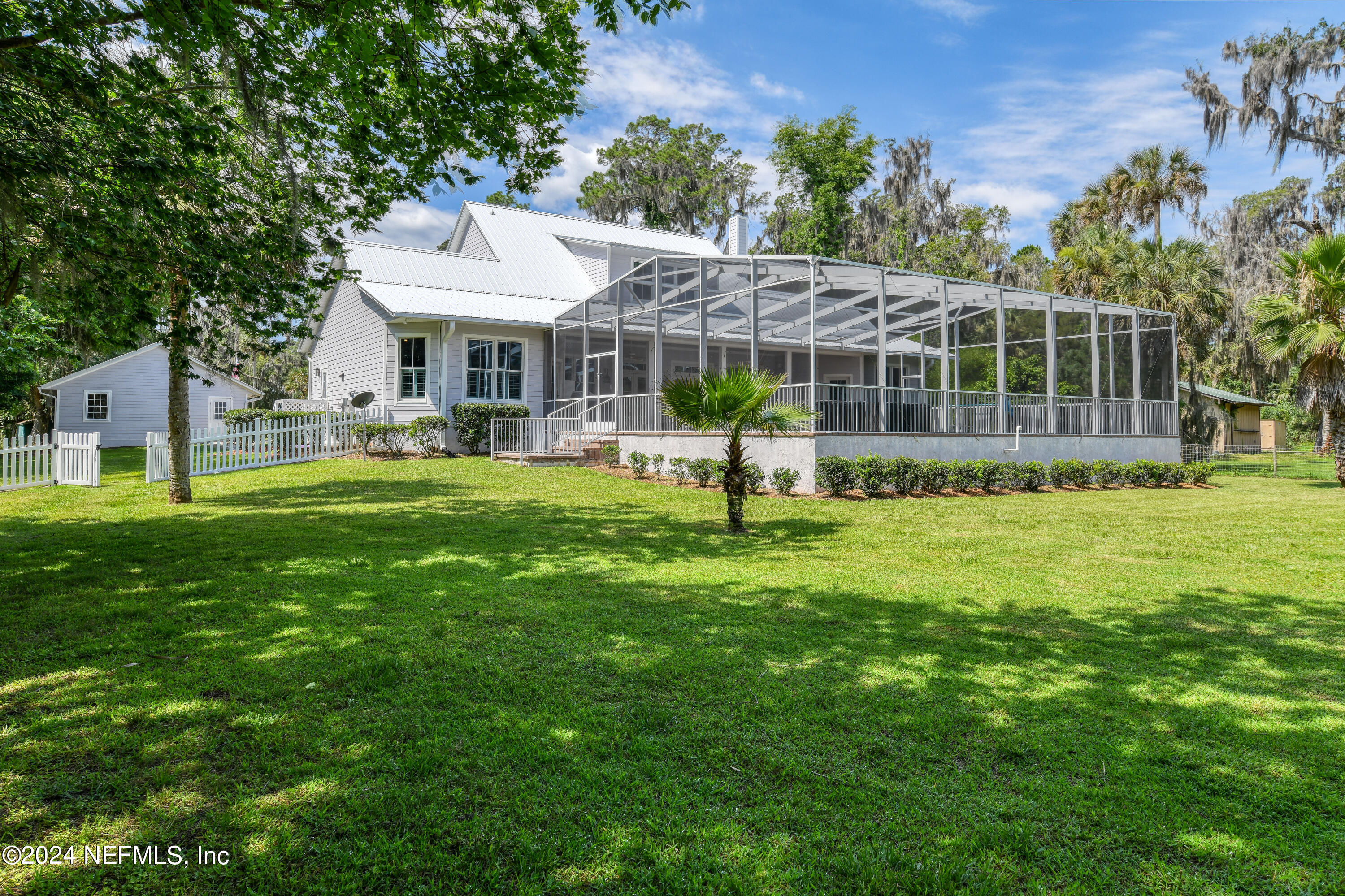 560 Clifton Road Crescent City, FL 32112 - Photo 26 of 73 a front view of a house with a yard