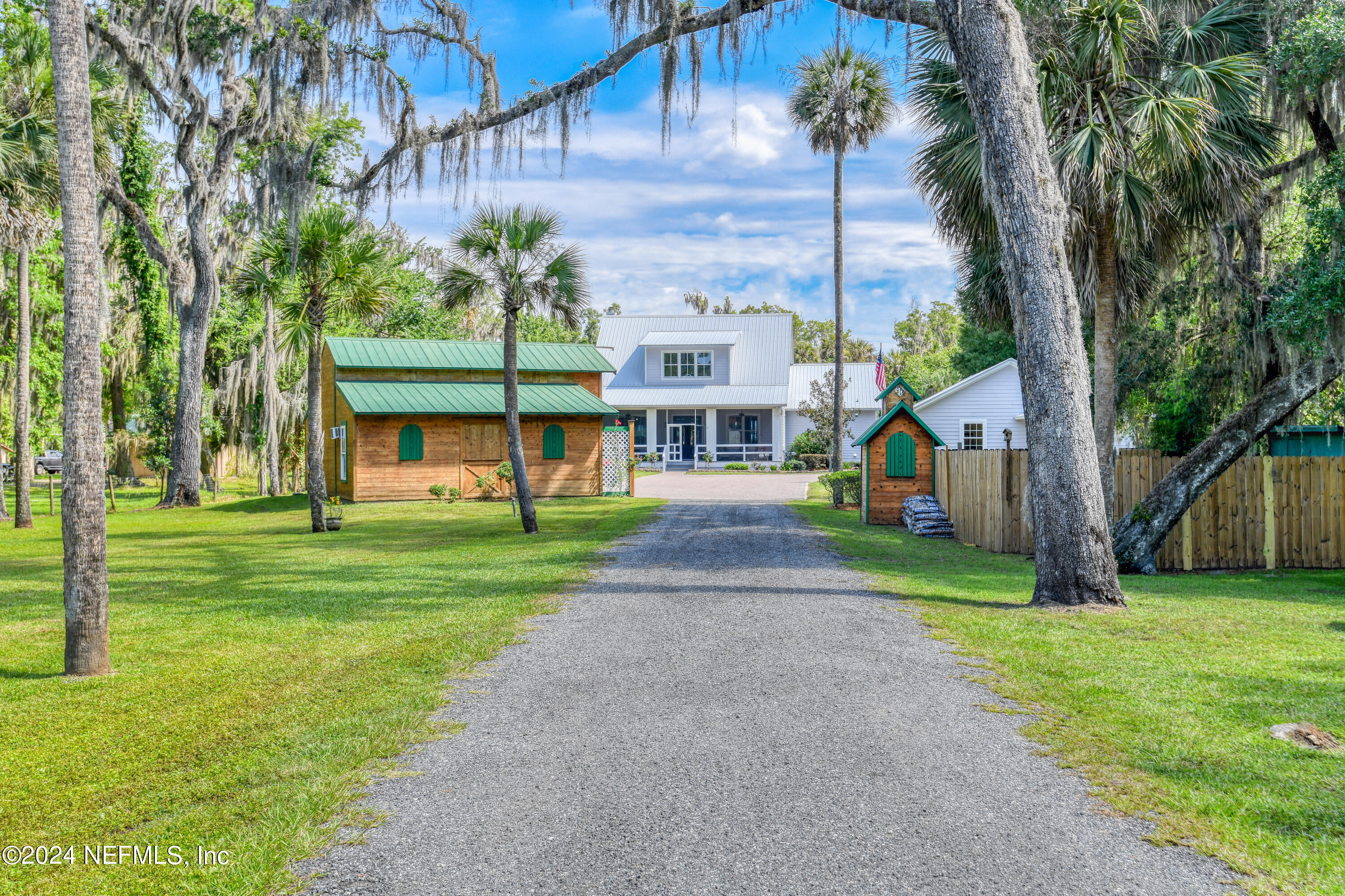 560 Clifton Road Crescent City, FL 32112 - Photo 3 of 73 a view of a big yard next to a house