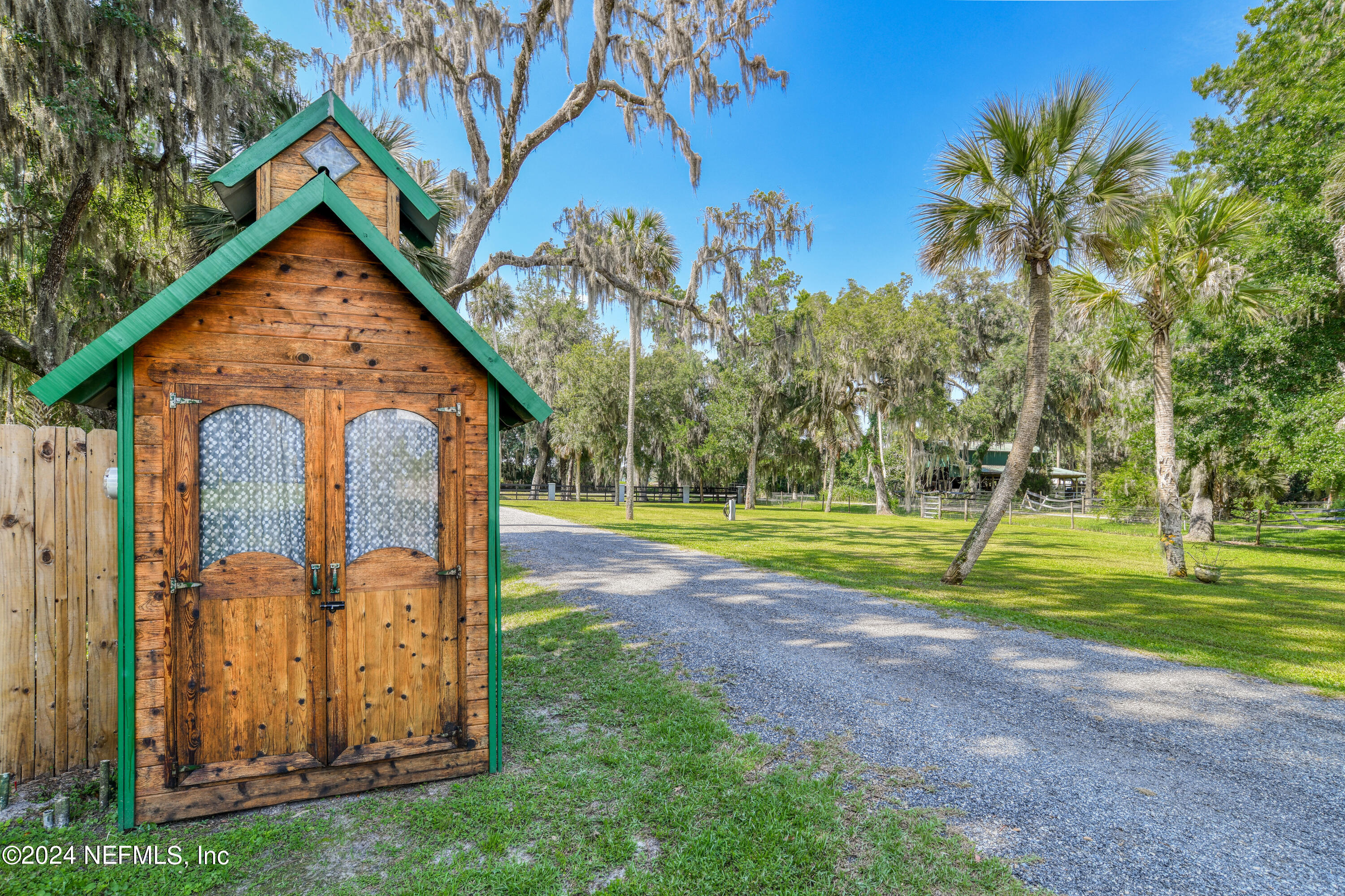 560 Clifton Road Crescent City, FL 32112 - Photo 60 of 73 a view of house with backyard and trees