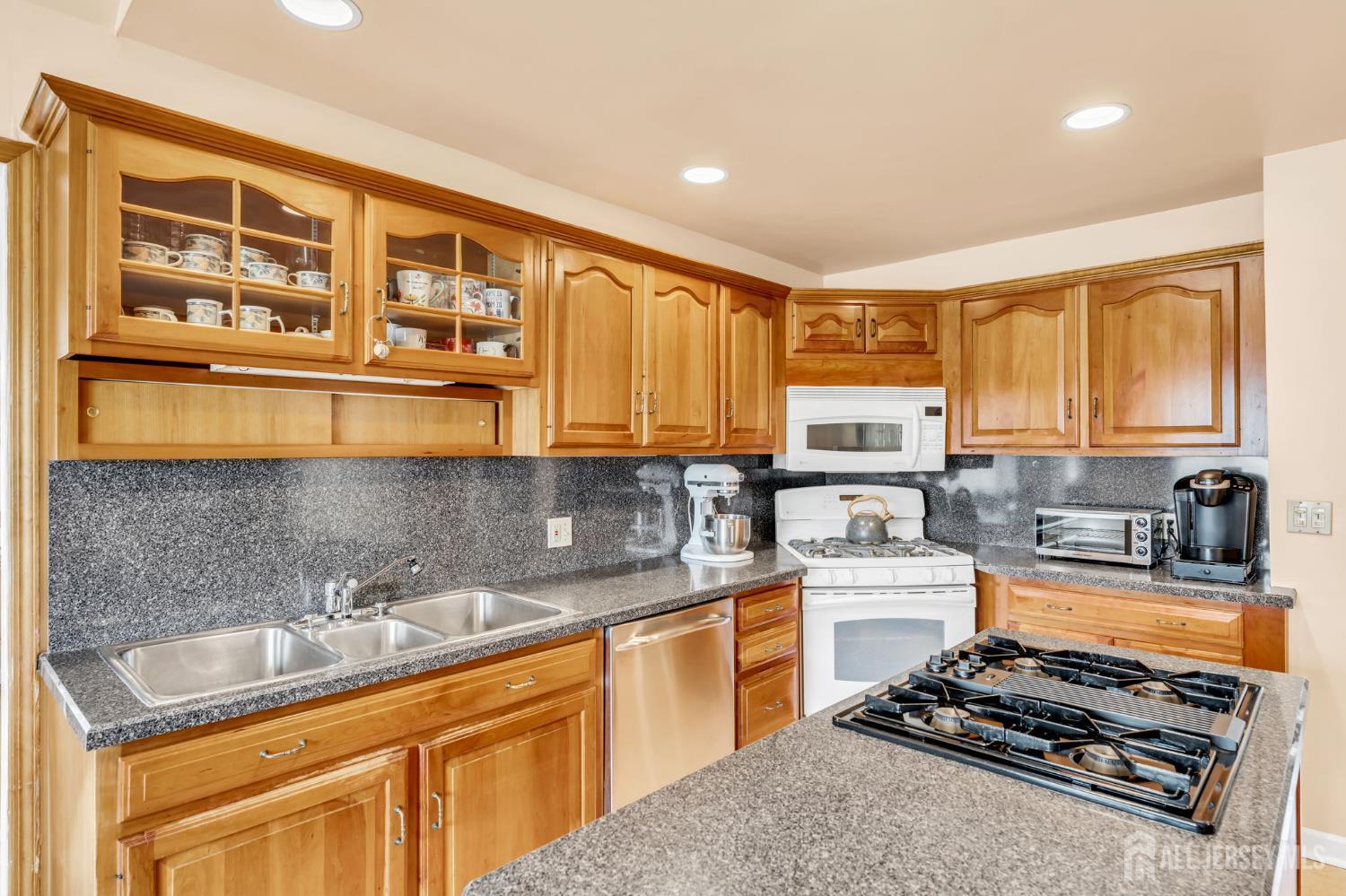42 Riveredge Road Tinton Falls, NJ 07724 - Photo 15 of 41 a kitchen with stainless steel appliances granite countertop a stove a sink and a microwave