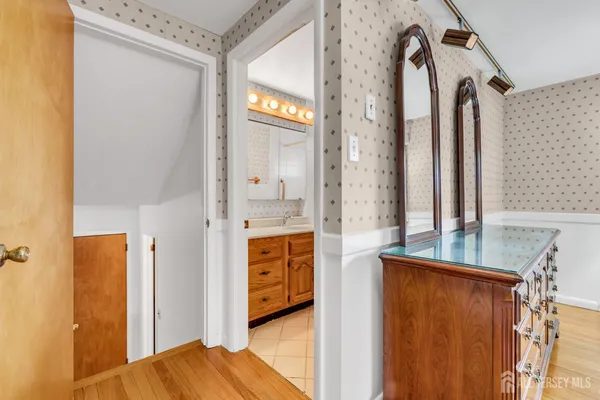 a view of bathroom with a tub and shower