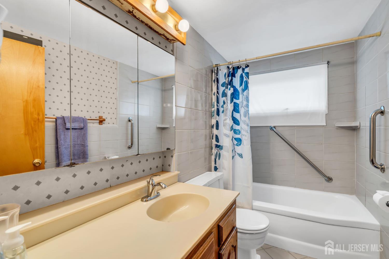 42 Riveredge Road Tinton Falls, NJ 07724 - Photo 22 of 41 a bathroom with a sink toilet and shower