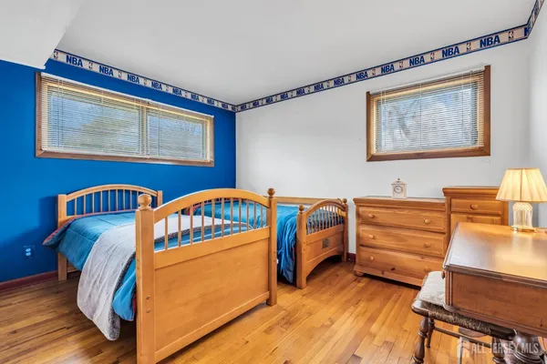 a bedroom with furniture and a window