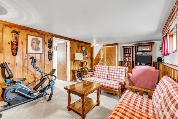 a bedroom with furniture and a window