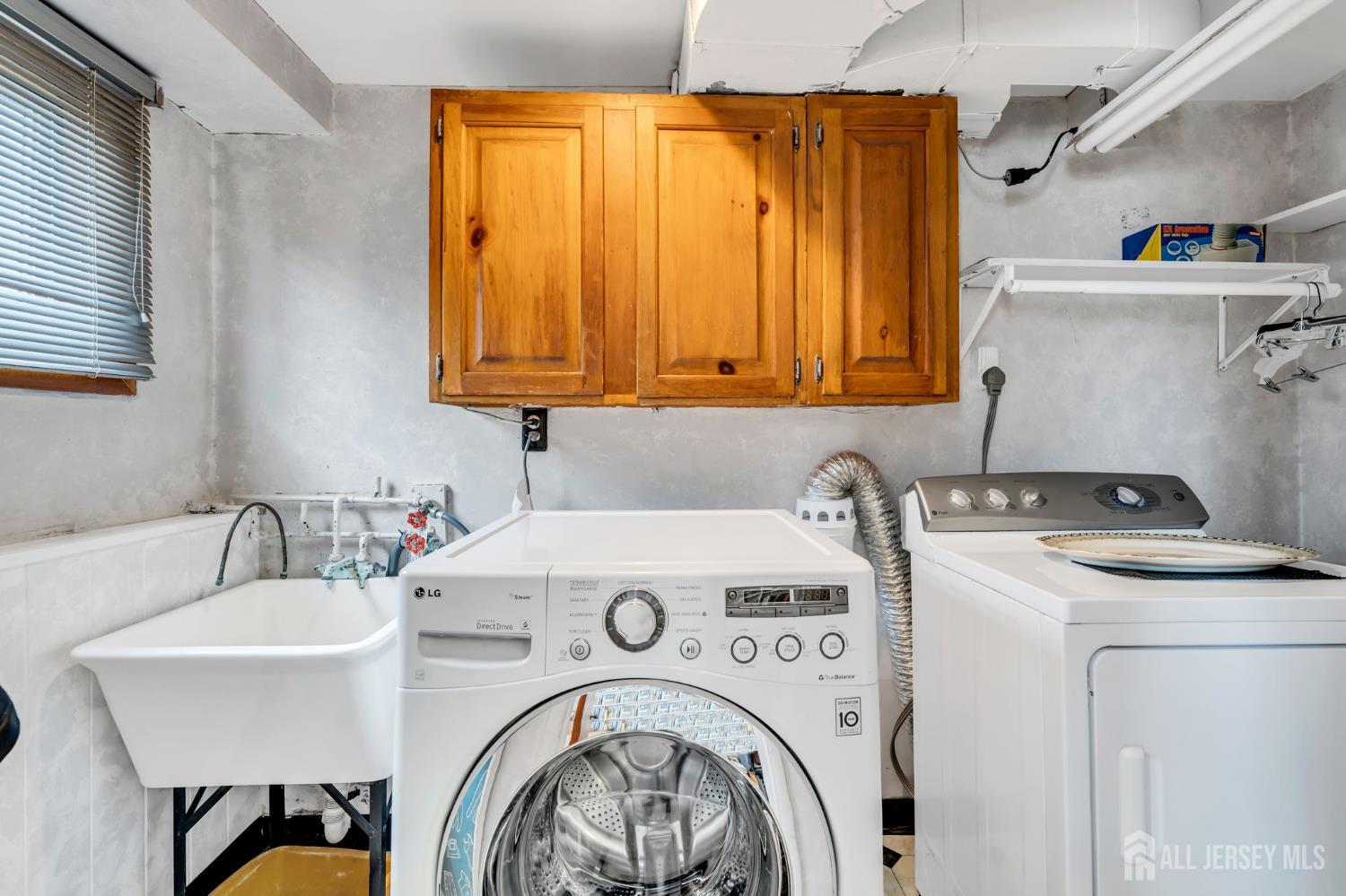 42 Riveredge Road Tinton Falls, NJ 07724 - Photo 35 of 41 a utility room with dryer and washer