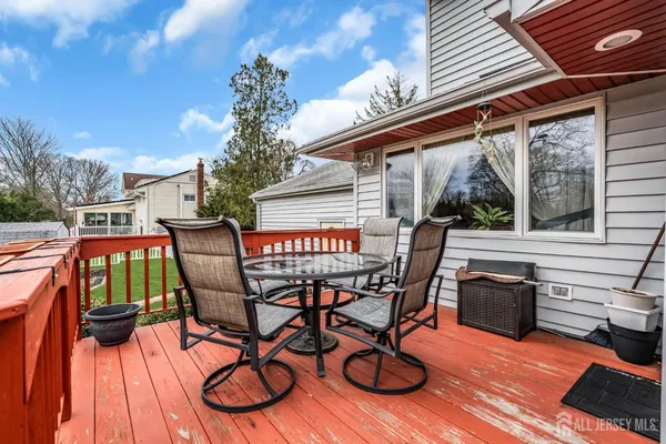 a view of a chairs and table in th patio