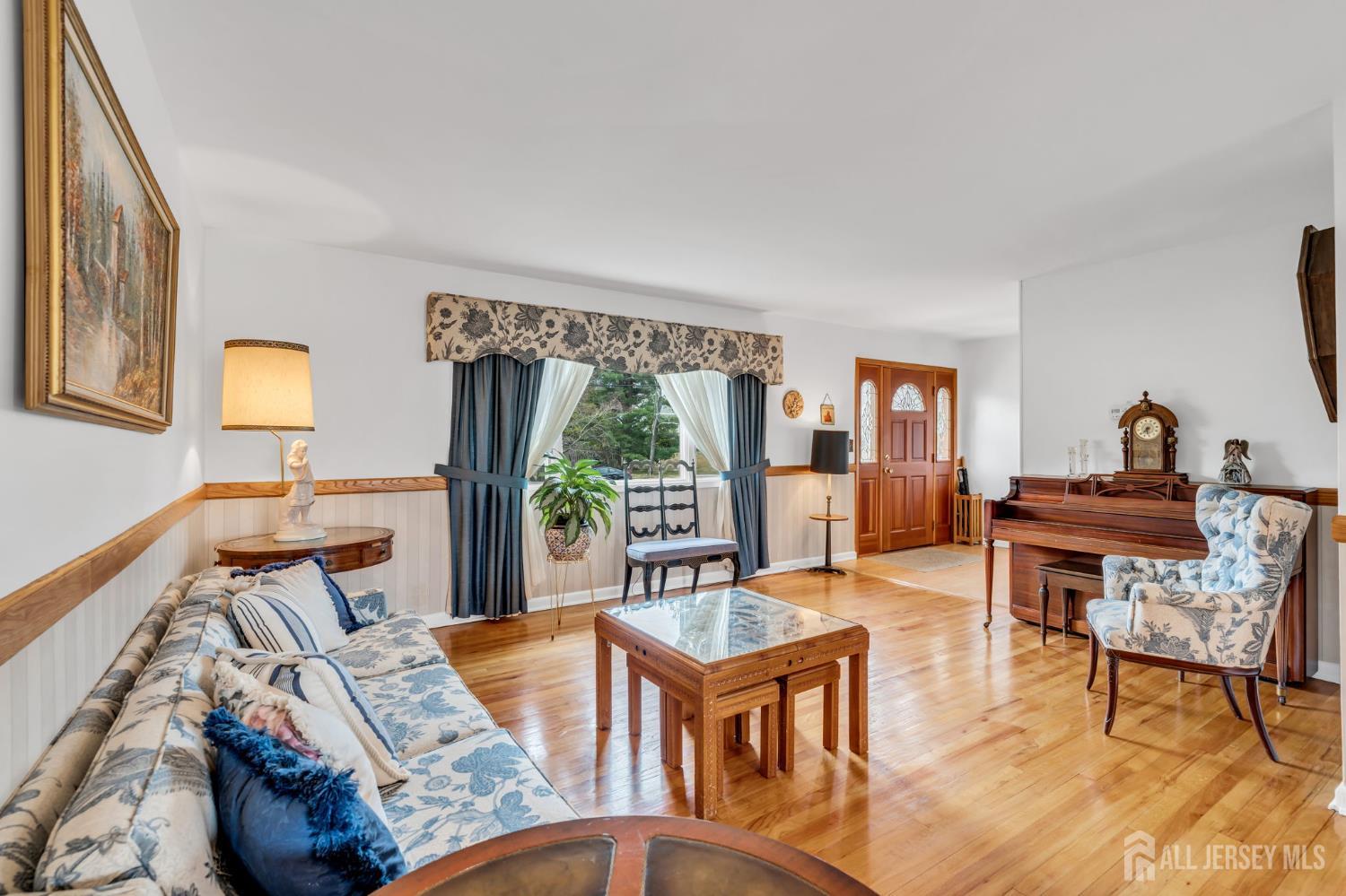42 Riveredge Road Tinton Falls, NJ 07724 - Photo 7 of 41 a living room with furniture and a wooden floor