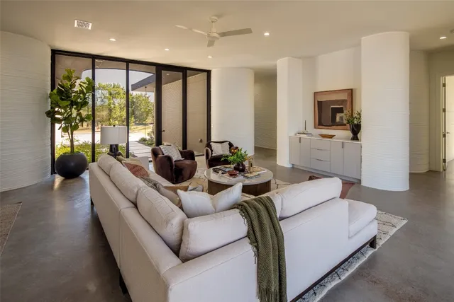 a living room with furniture and a large window