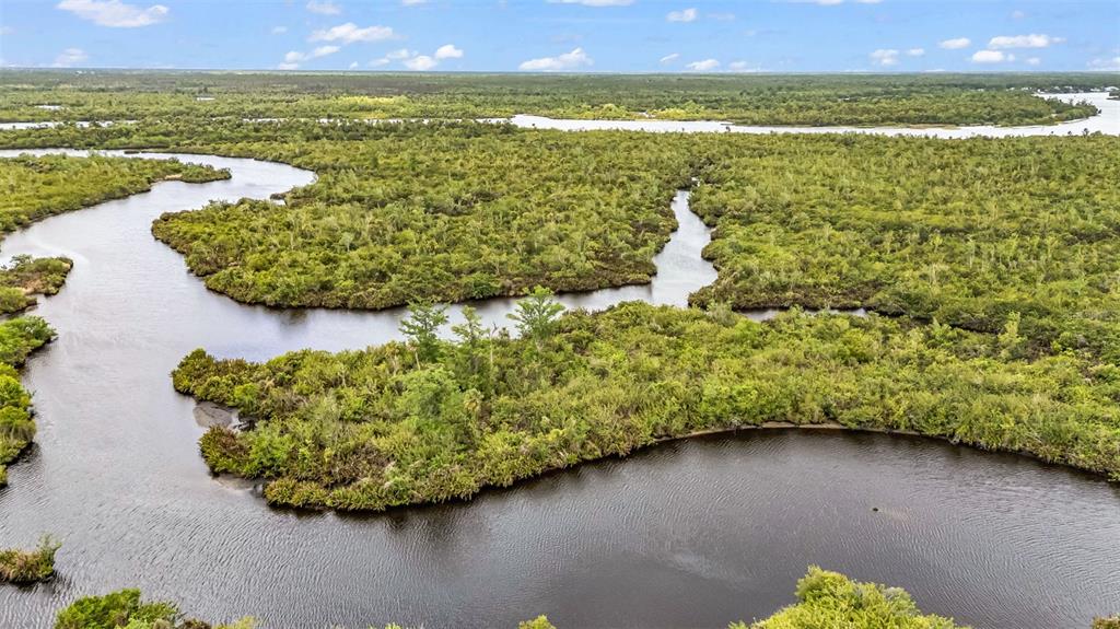 Southwest Sunnybreeze Road Arcadia, FL 34269 - Photo 27 of 50 a view of a lake with a mountain