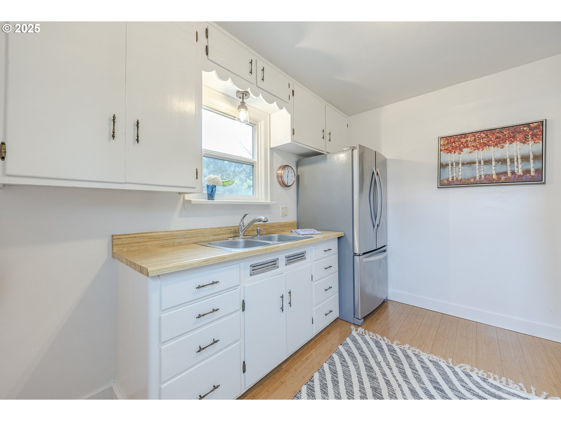 3797 Kincaid Street Eugene, OR 97405 - Photo 12 of 37 a kitchen with granite countertop a sink a refrigerator and a stove