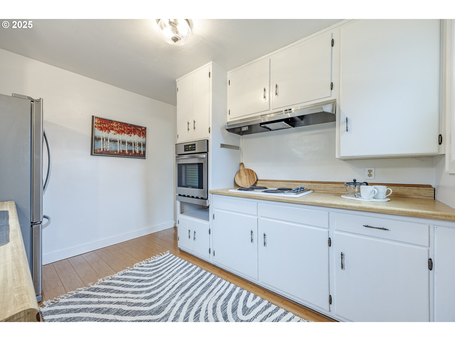 3797 Kincaid Street Eugene, OR 97405 - Photo 13 of 37 a kitchen with cabinets and appliances