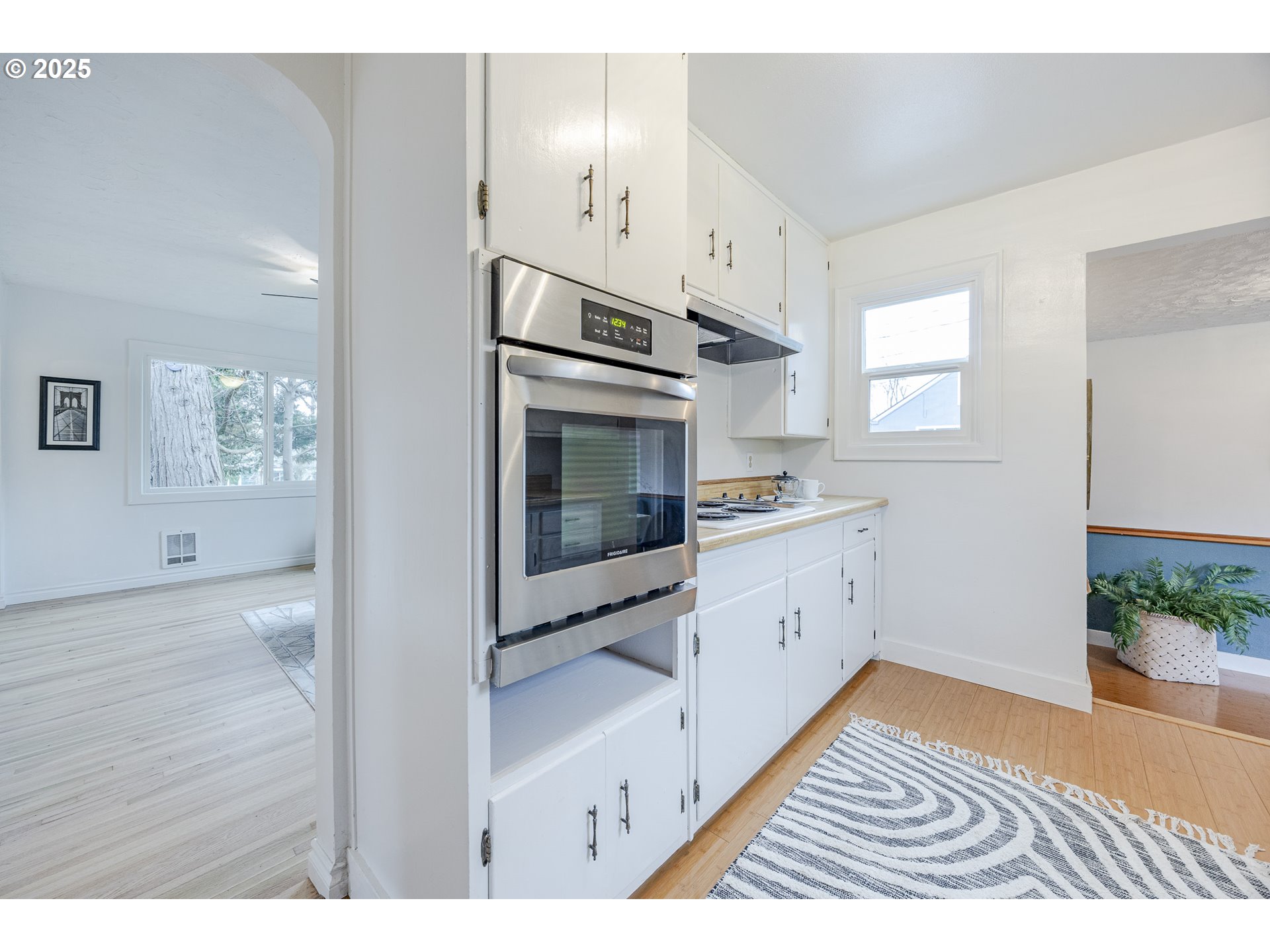 3797 Kincaid Street Eugene, OR 97405 - Photo 14 of 37 a kitchen with stainless steel appliances granite countertop a stove a sink and a microwave