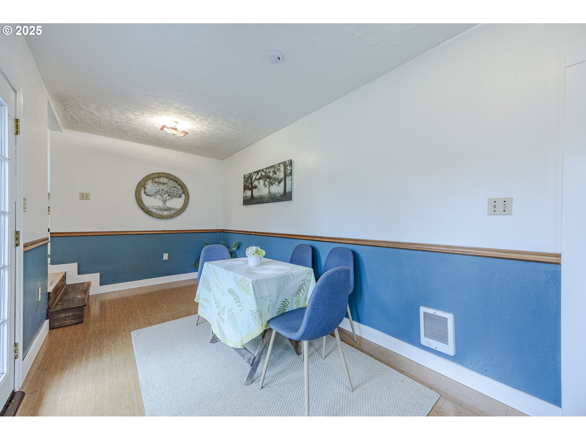 3797 Kincaid Street Eugene, OR 97405 - Photo 19 of 37 a living room with furniture and a clock