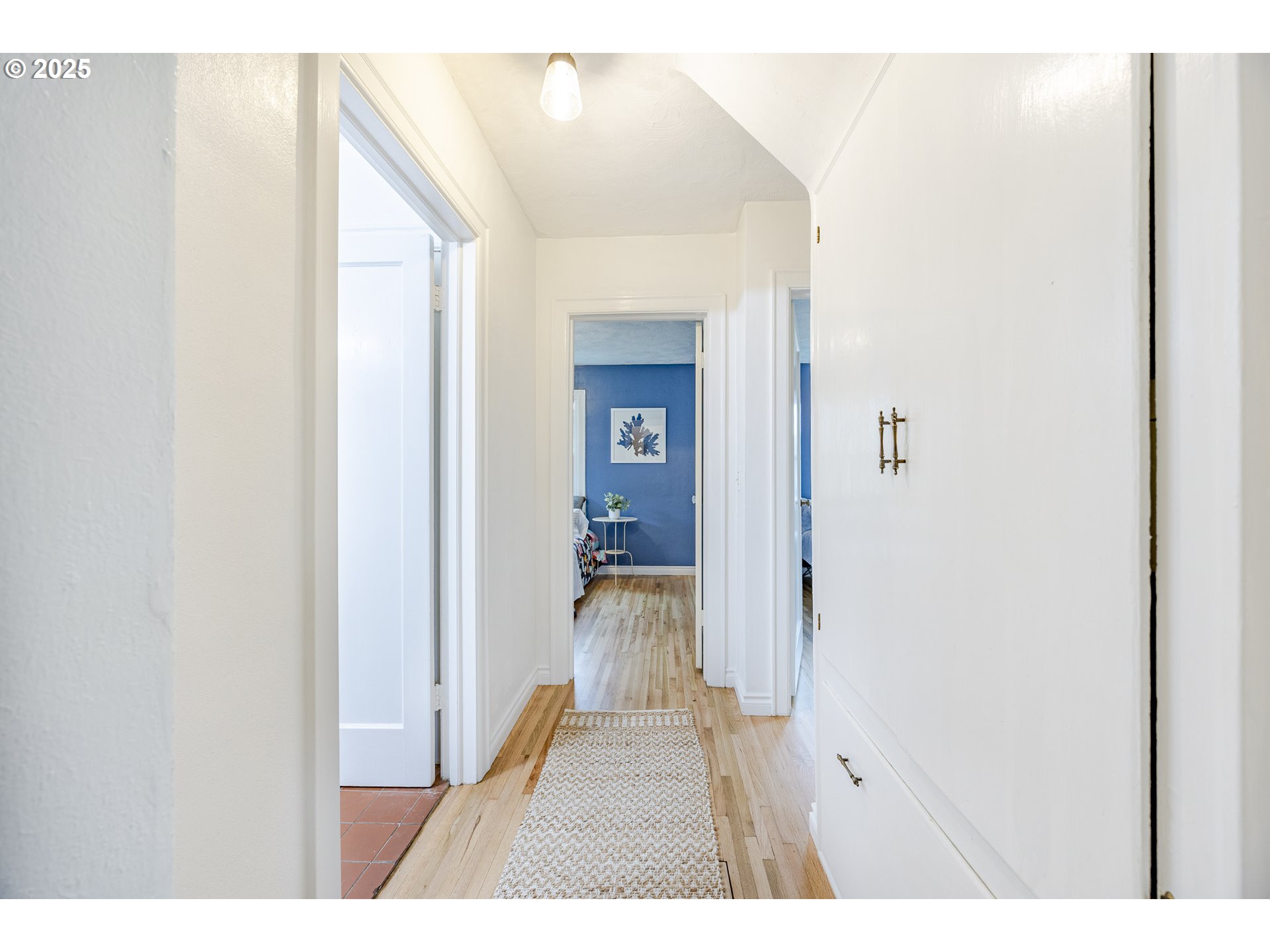 3797 Kincaid Street Eugene, OR 97405 - Photo 20 of 37 a view of a hallway view with wooden floor and staircase