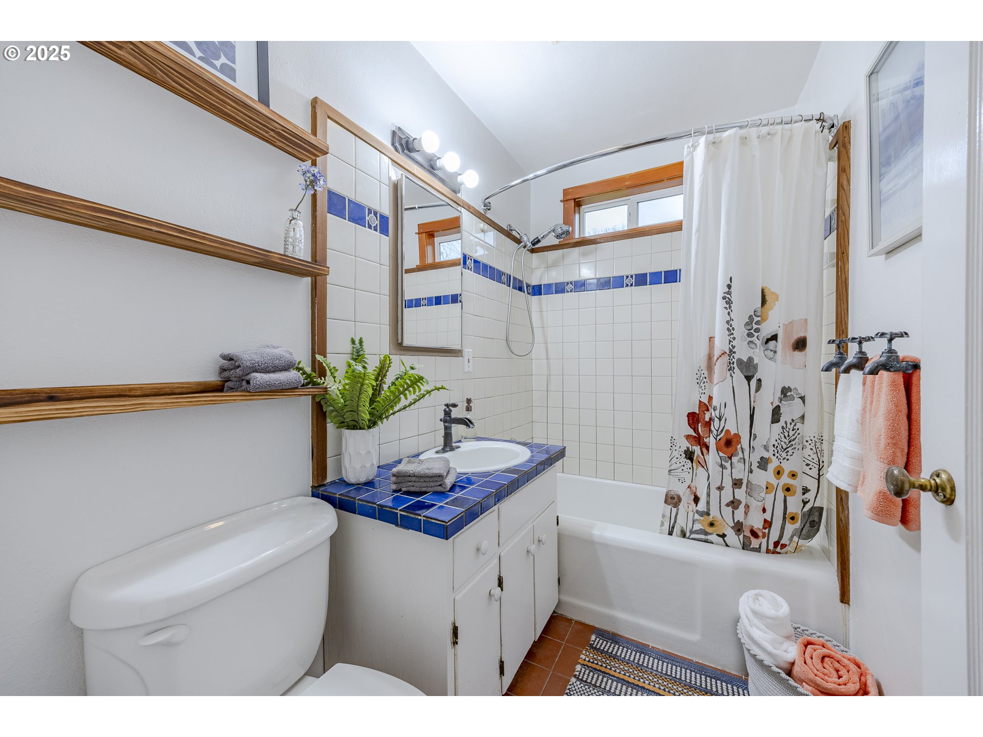 3797 Kincaid Street Eugene, OR 97405 - Photo 21 of 37 a bathroom with a sink a vanity and a bathtub