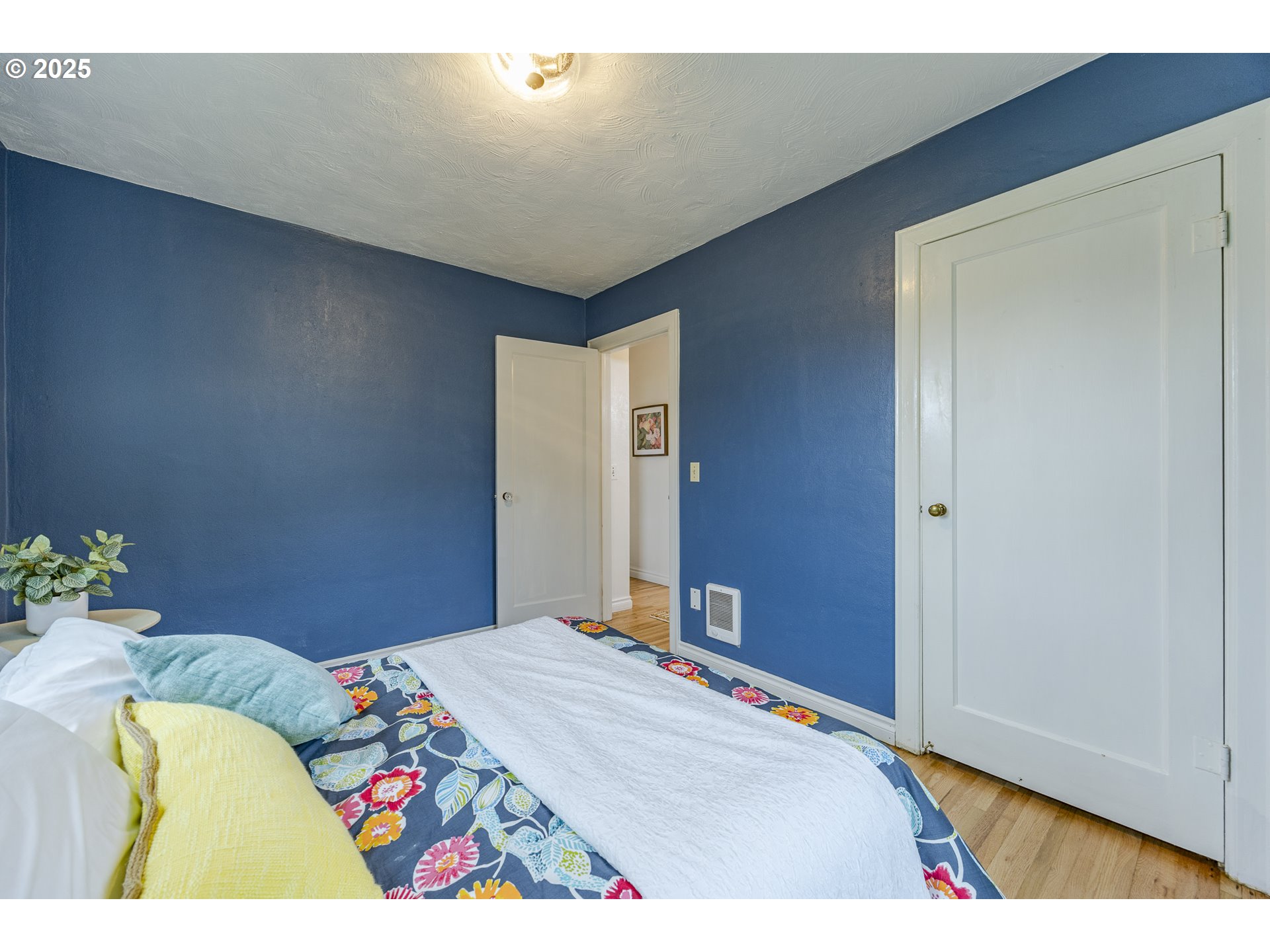 3797 Kincaid Street Eugene, OR 97405 - Photo 24 of 37 a bed sitting in a bedroom and a table in it