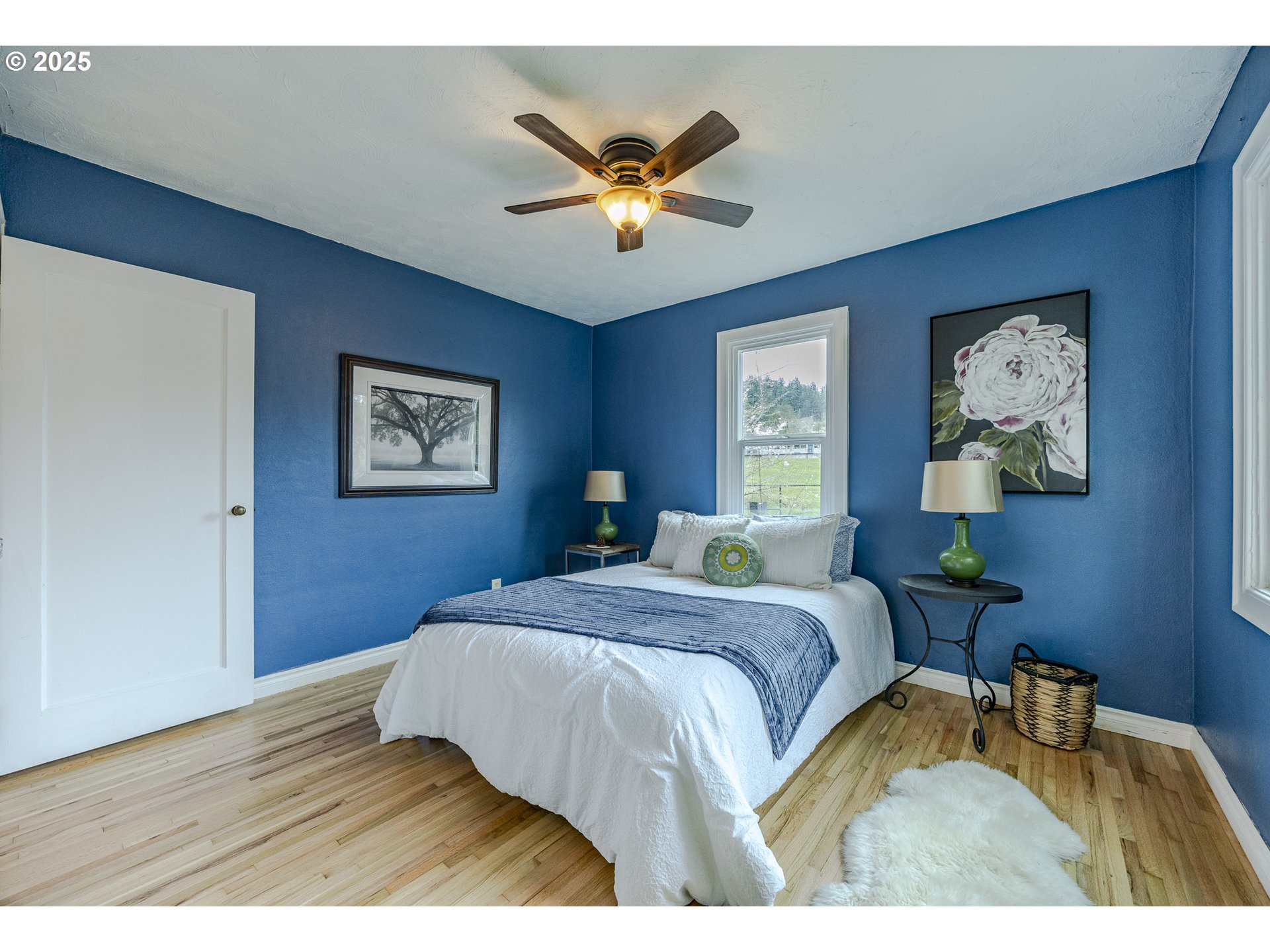 3797 Kincaid Street Eugene, OR 97405 - Photo 27 of 37 a bedroom with a bed and a chandelier