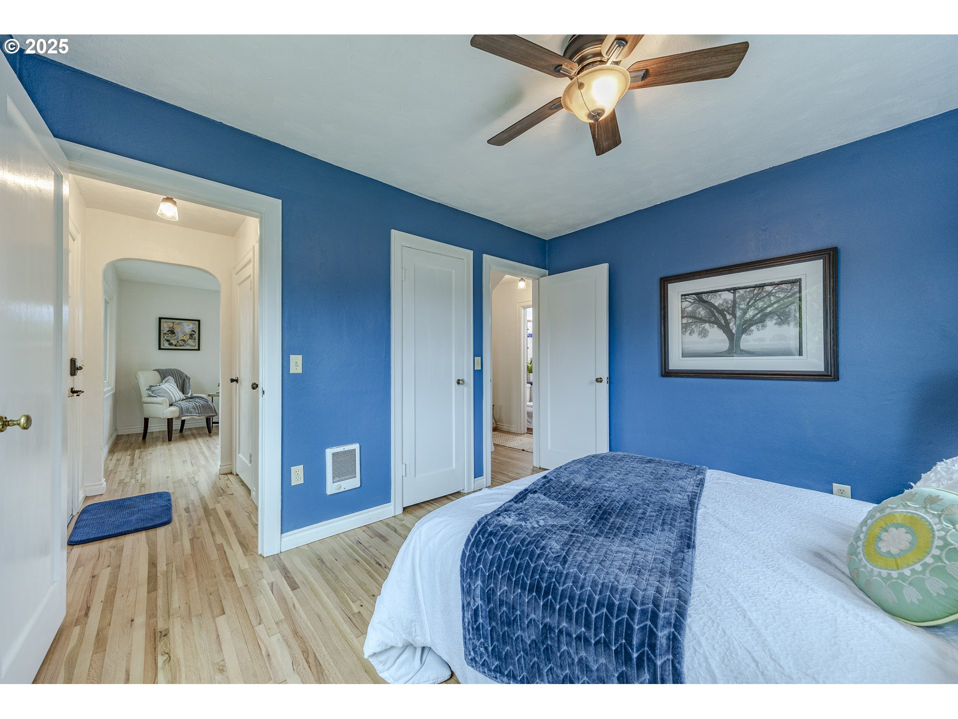 3797 Kincaid Street Eugene, OR 97405 - Photo 28 of 37 a bedroom with a bed and a chandelier