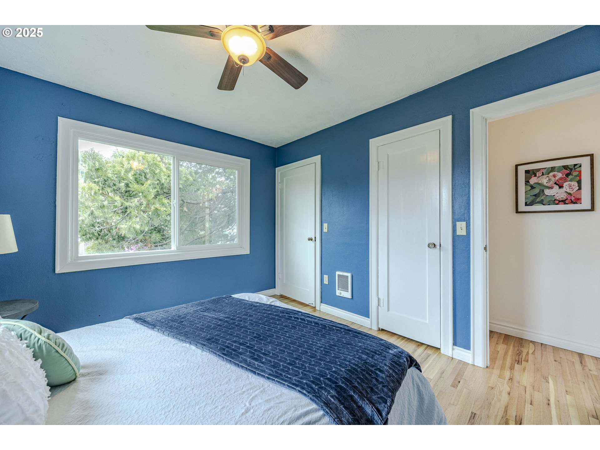 3797 Kincaid Street Eugene, OR 97405 - Photo 30 of 37 a bedroom with a bed and a chandelier