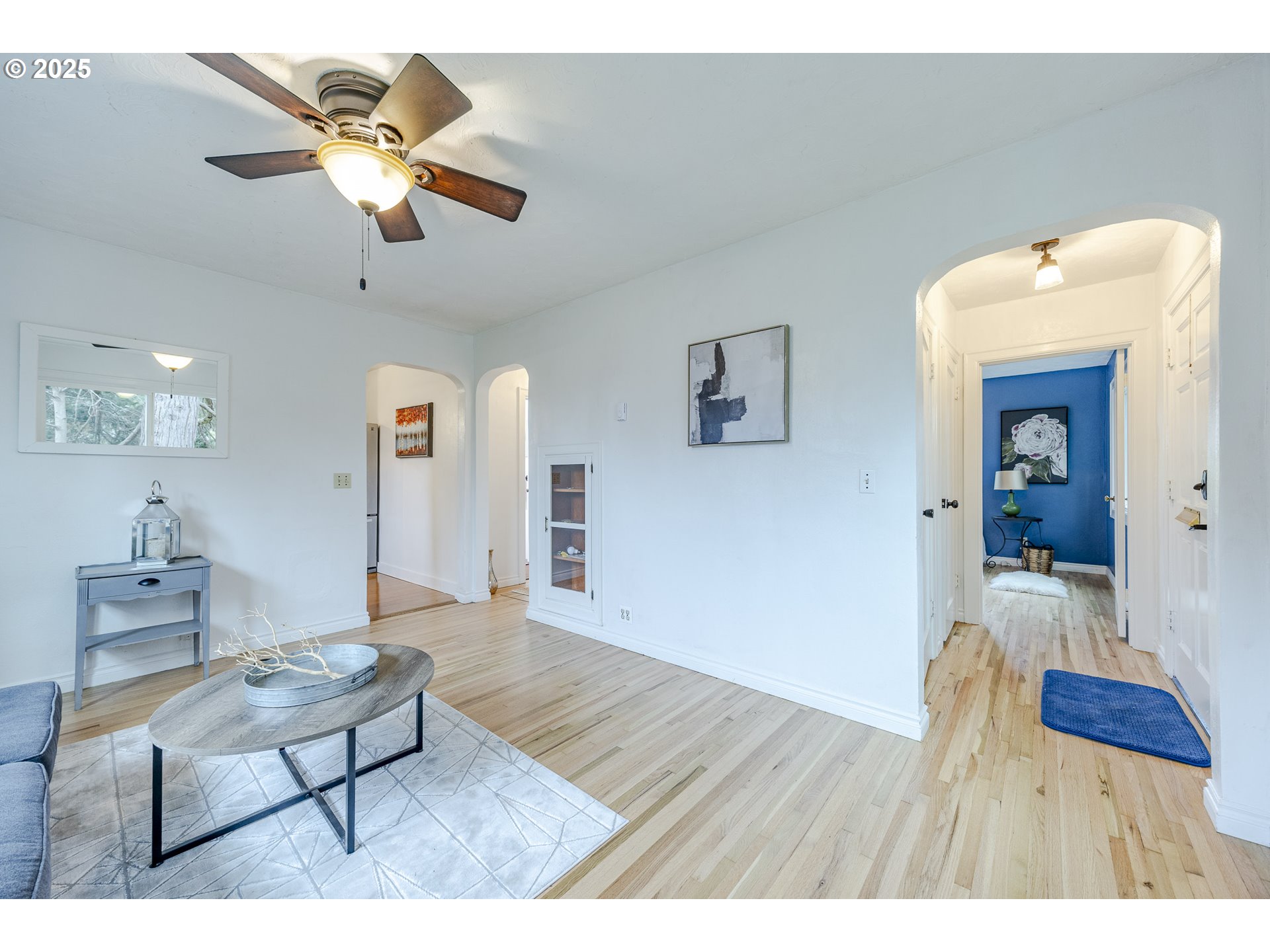 3797 Kincaid Street Eugene, OR 97405 - Photo 8 of 37 a living room with furniture and a chandelier