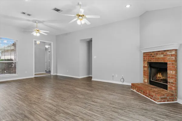 a view of a kitchen from the hallway