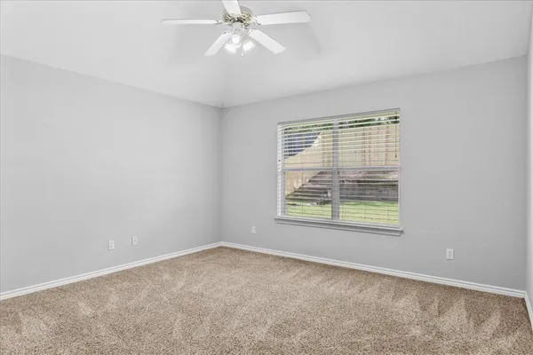 an empty room with a bathroom