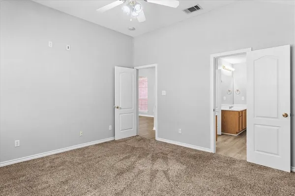 a room with cabinets and wooden floor