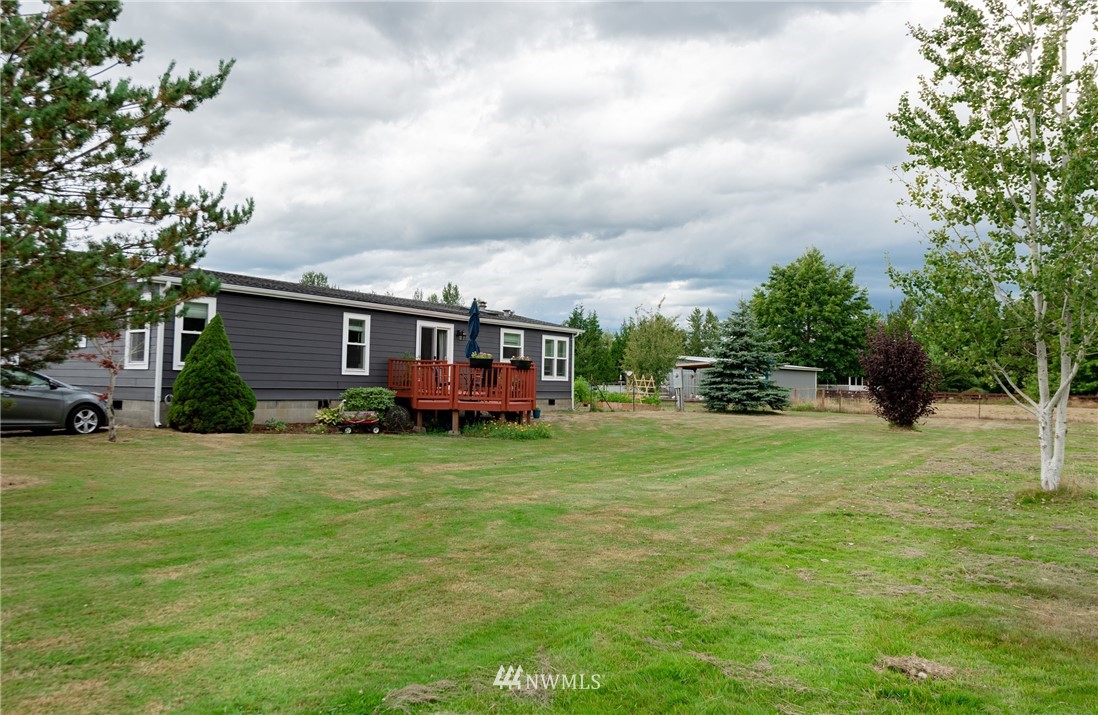 6565 Old Guide Road Bellingham, WA 98226 - Photo 1 of 27 a view of a house with a backyard