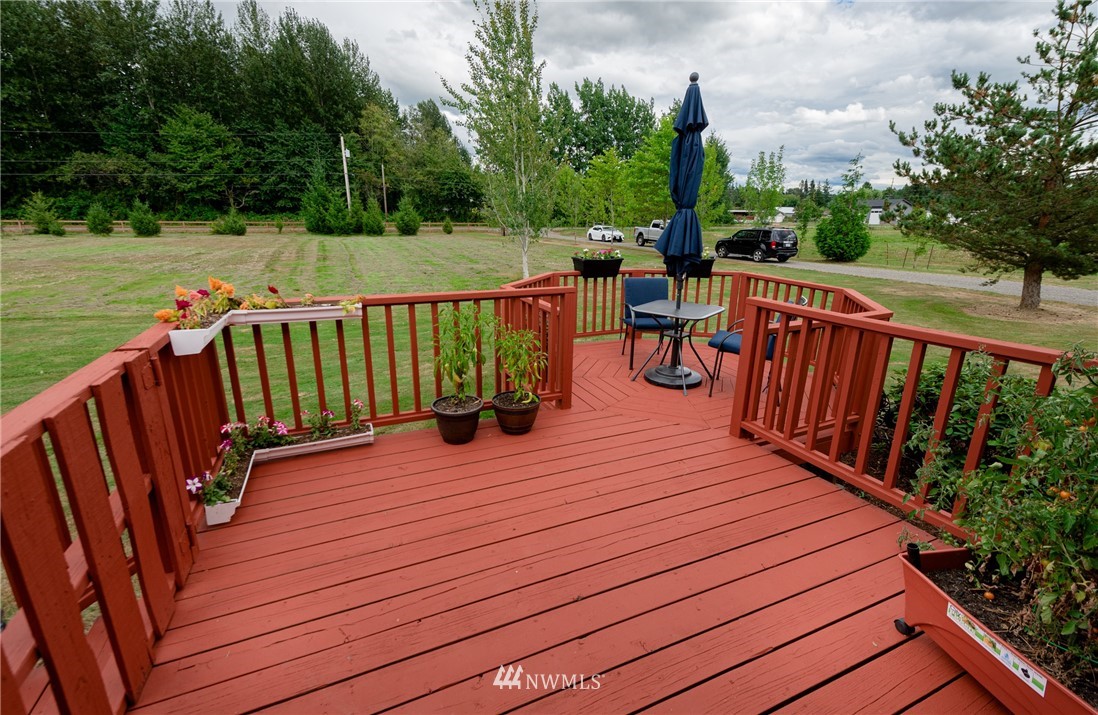 6565 Old Guide Road Bellingham, WA 98226 - Photo 2 of 27 a view of deck with wooden floor and outdoor seating