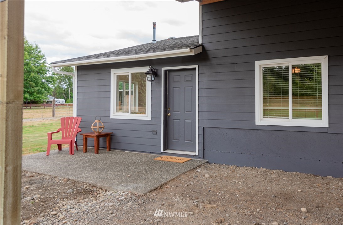 6565 Old Guide Road Bellingham, WA 98226 - Photo 20 of 27 a view of a house with a backyard and sitting area