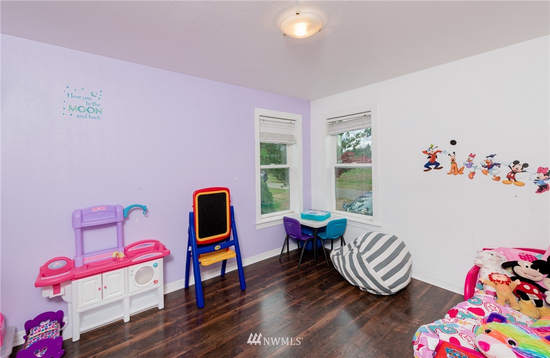 6565 Old Guide Road Bellingham, WA 98226 - Photo 21 of 27 a living room with furniture and a wooden floor