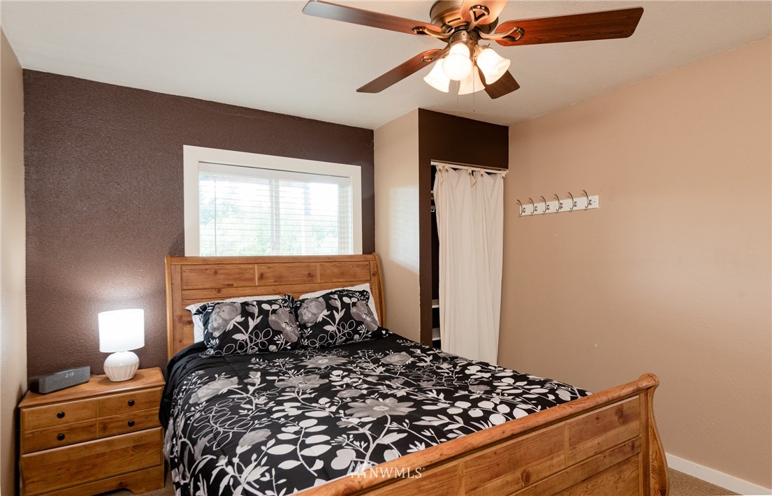 6565 Old Guide Road Bellingham, WA 98226 - Photo 27 of 27 a bed sitting in a bedroom next to a window
