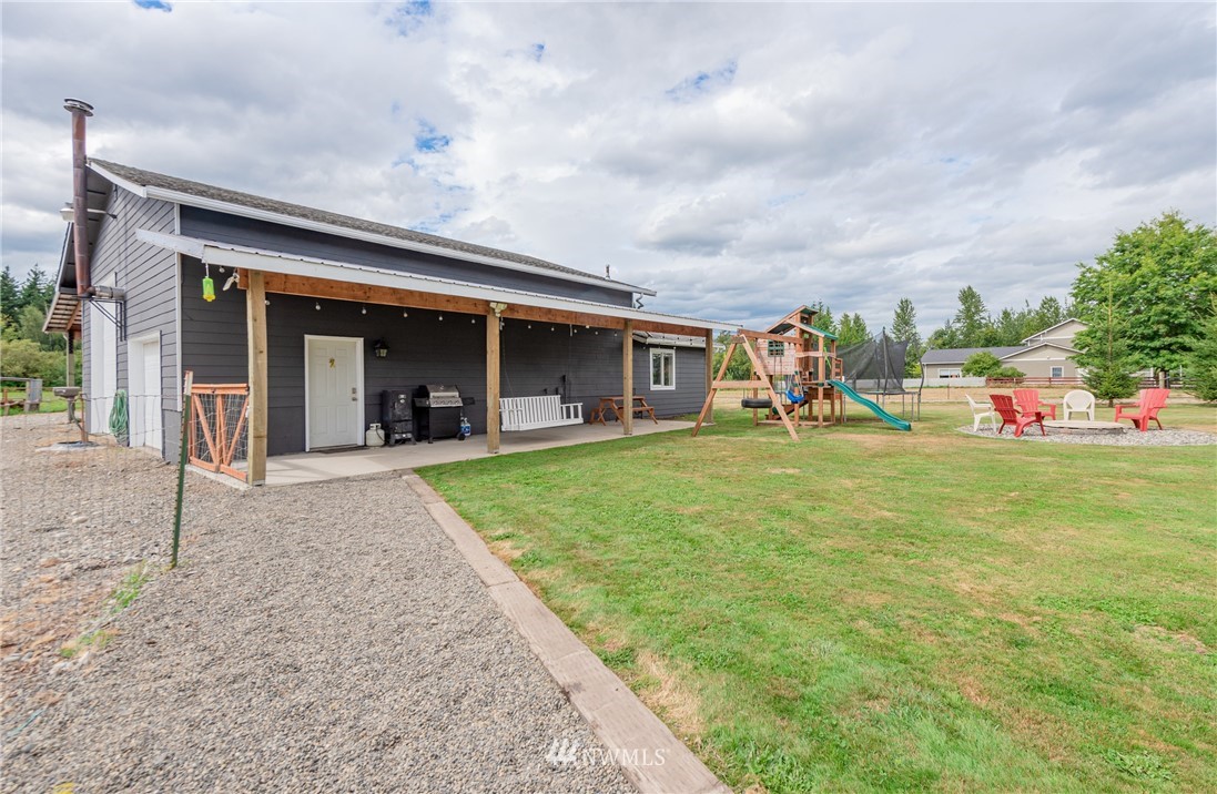 6565 Old Guide Road Bellingham, WA 98226 - Photo 6 of 27 a view of a house with backyard porch and garden