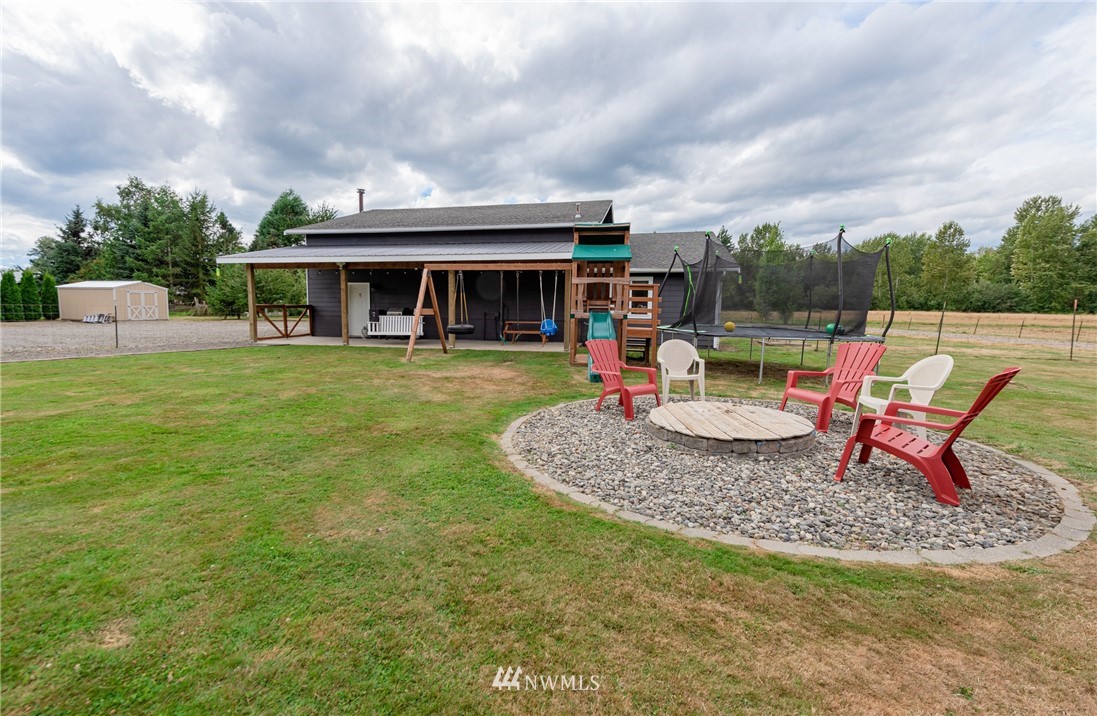 6565 Old Guide Road Bellingham, WA 98226 - Photo 7 of 27 a view of a house with backyard and sitting area