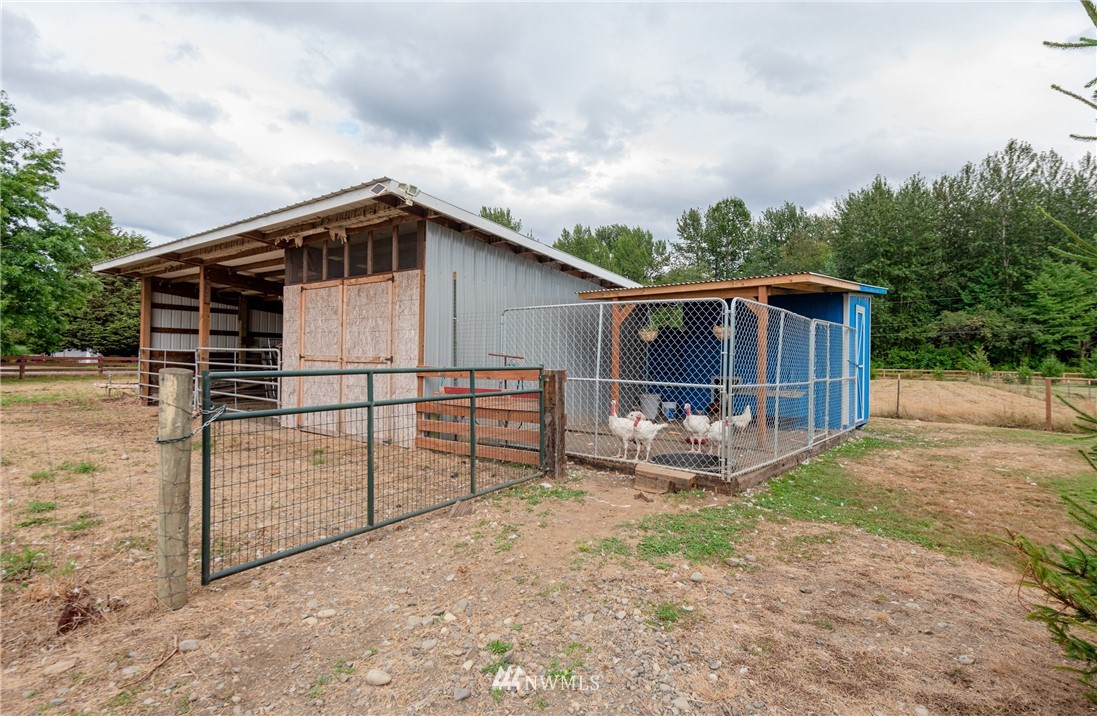 6565 Old Guide Road Bellingham, WA 98226 - Photo 9 of 27 a view of a house with wooden fence