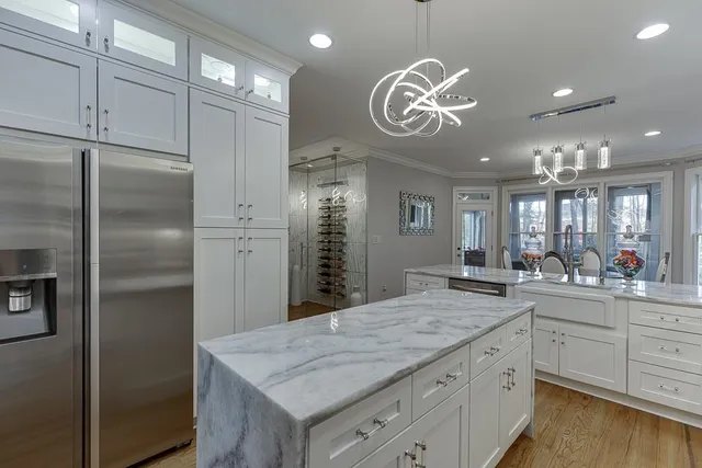 a bathroom with a sink a mirror a toilet and a window