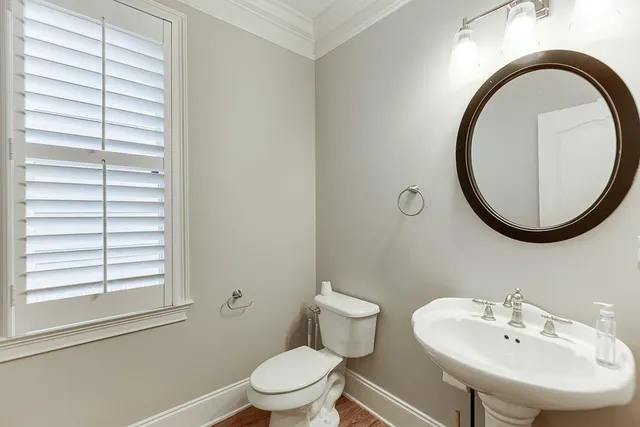 a bedroom with a large bed and a flat screen tv