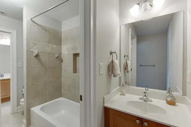 a large spacious bathroom with a large tub and sink