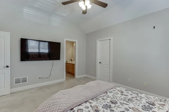 a view of a livingroom with furniture and a window