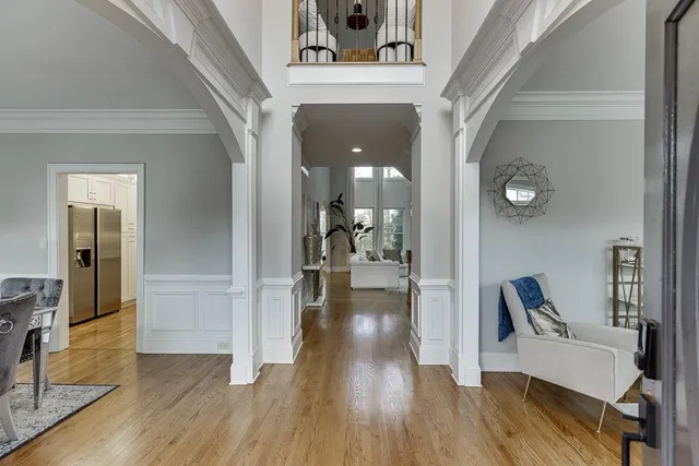 a view of a hallway view with wooden floor and staircase