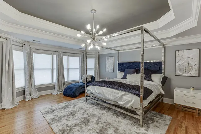 a bedroom with bed and a couch