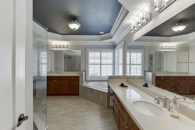 a view of a patio with table and chairs under an umbrella