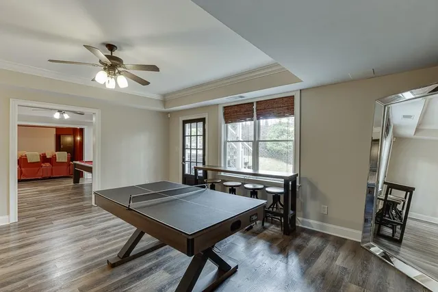 a view of backyard of house with green space