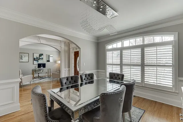 a view of a dining room with furniture window and wooden floor