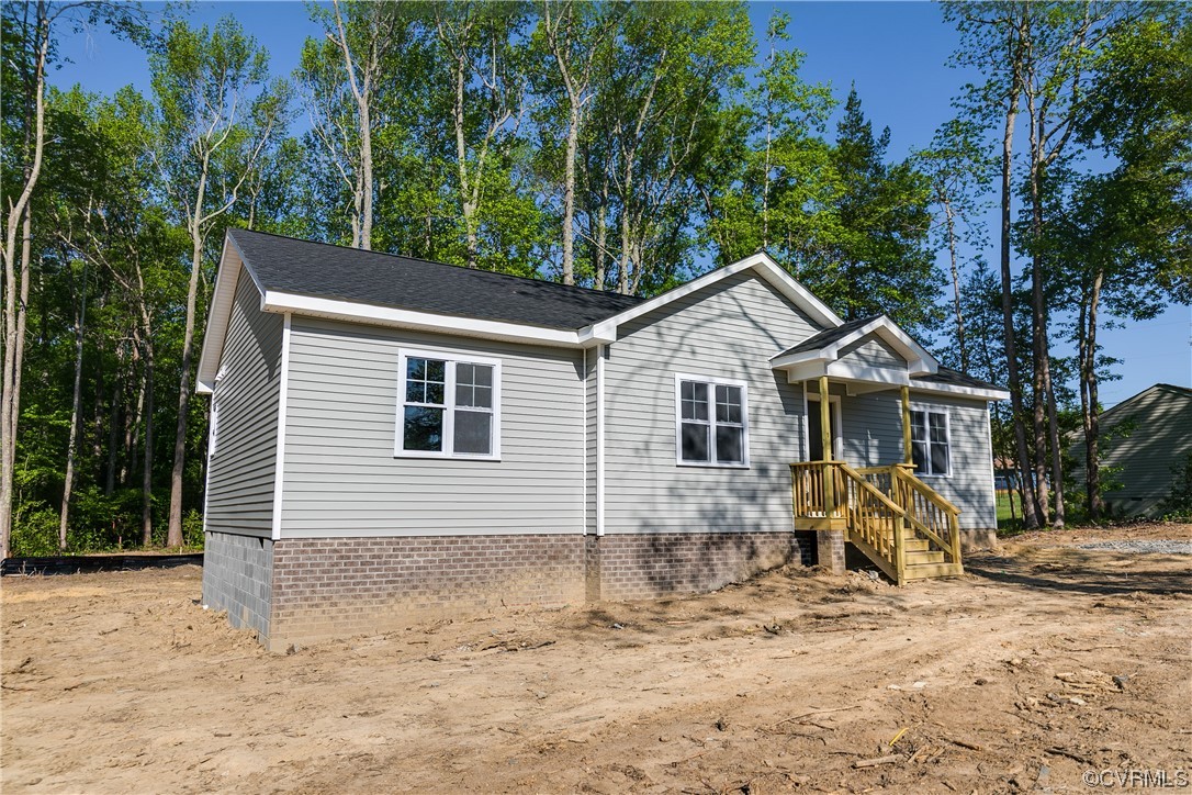 15318 Saddlebrook Road Chesterfield, VA 23838 - Photo 3 of 10 a view of a yard in front of a house with large tree