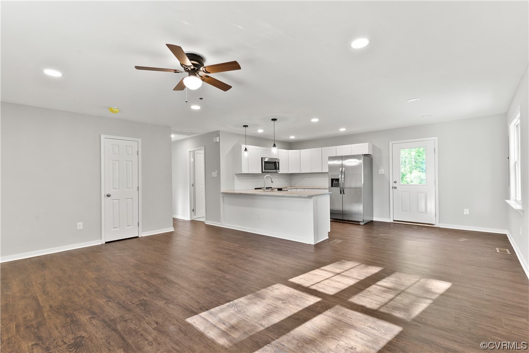 15318 Saddlebrook Road Chesterfield, VA 23838 - Photo 7 of 10 a view of kitchen view with wooden floor and stainless steel appliances