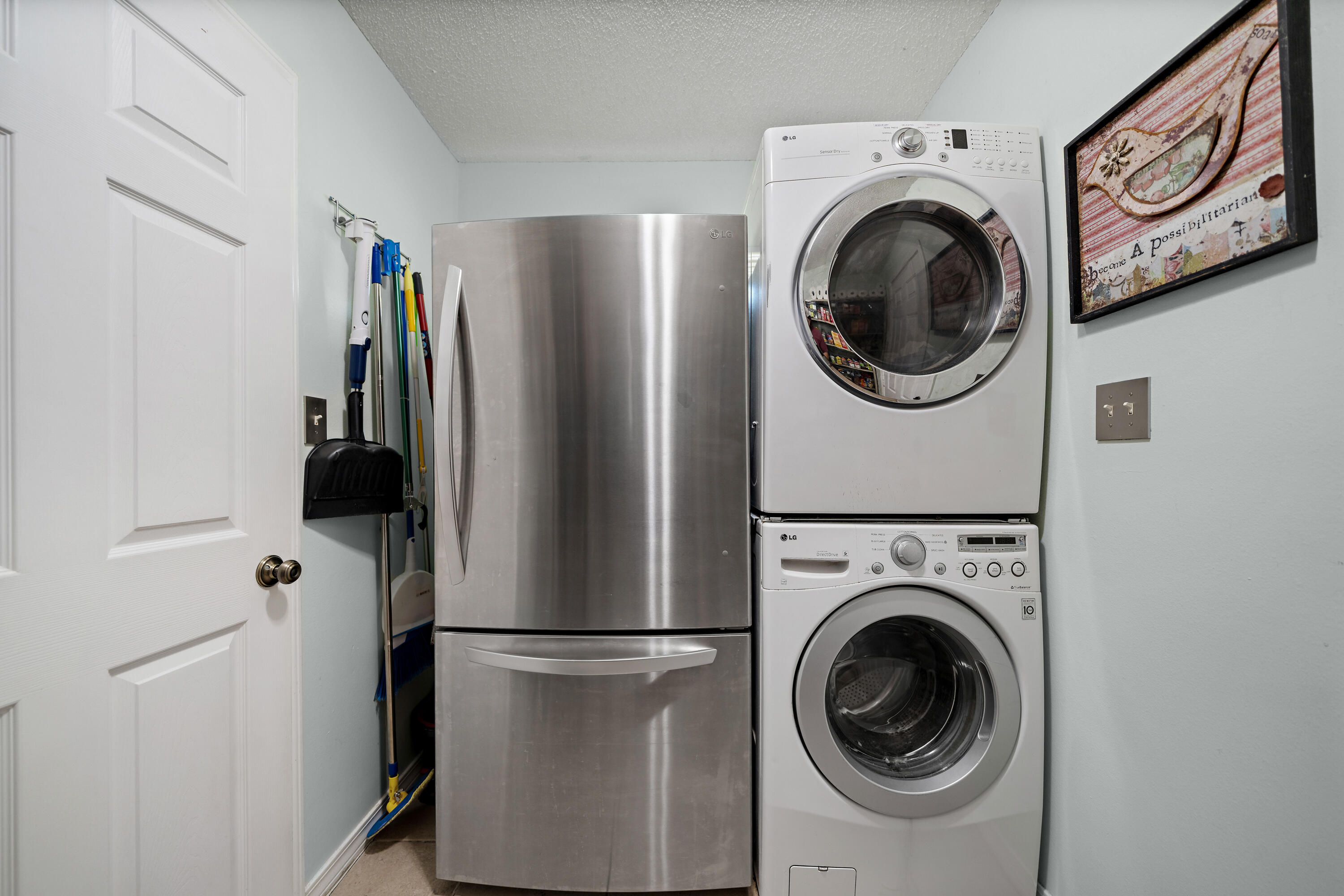 3879 Mesa Road Destin, FL 32541 - Photo 12 of 27 a utility room with dryer and washer