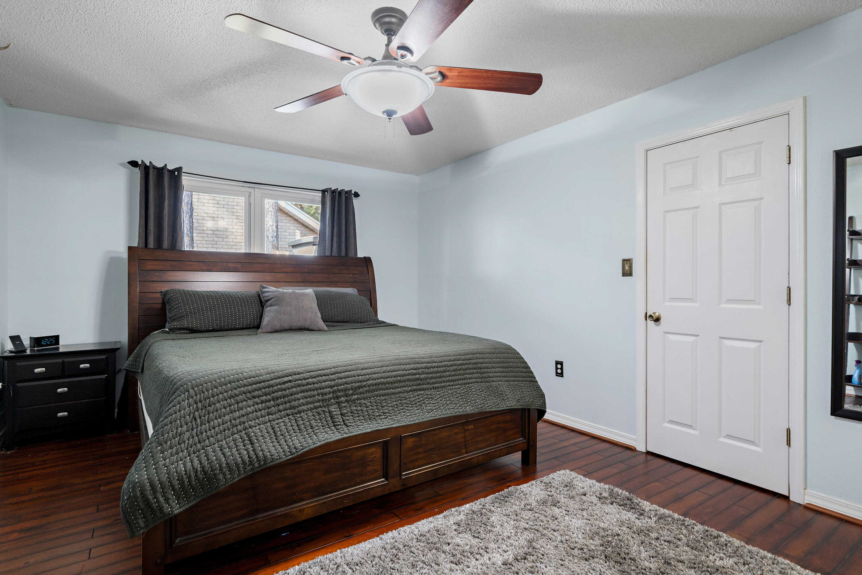 3879 Mesa Road Destin, FL 32541 - Photo 14 of 27 a bedroom with a bed and wooden floor